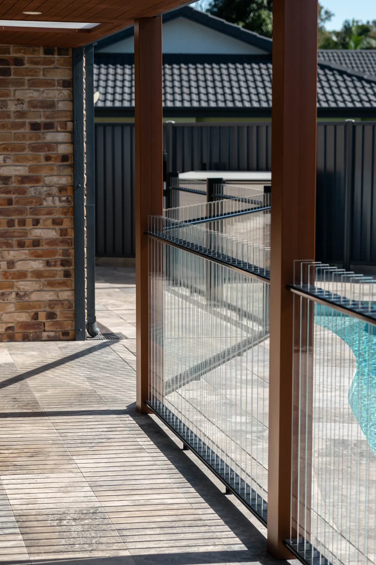 Completed black Flo Glass Fence around a residential pool